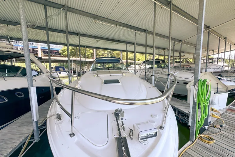 Slide: The Image of 2001 Sea Ray 410 Sundancer yacht docked in a covered marina. - 3