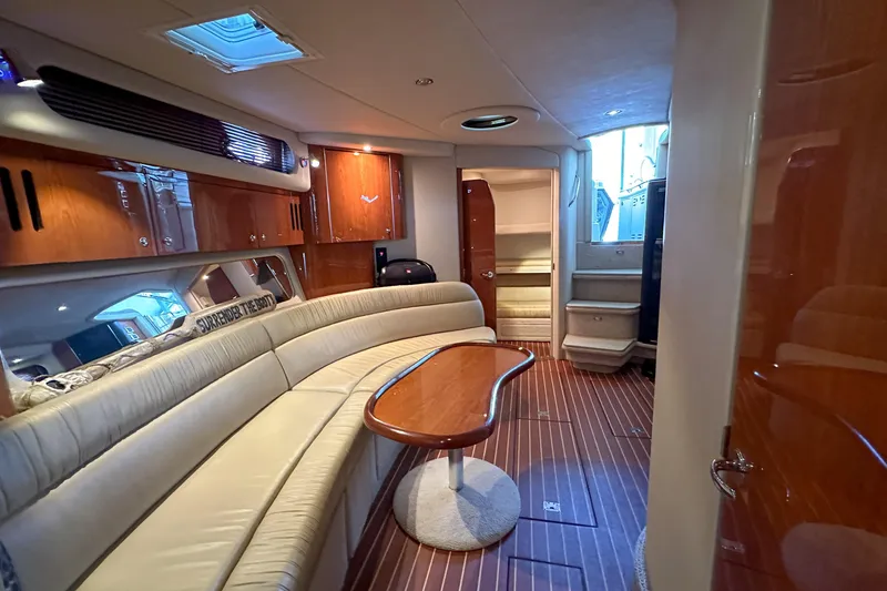 Slide: The Image of Luxurious interior of a 2001 Sea Ray 410 Sundancer yacht with elegant seating and wood finishes. - 33