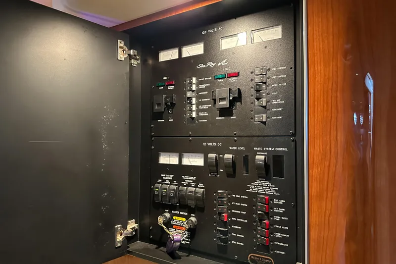 Slide: The Image of Electrical control panel inside a 2001 Sea Ray 410 Sundancer yacht. - 36