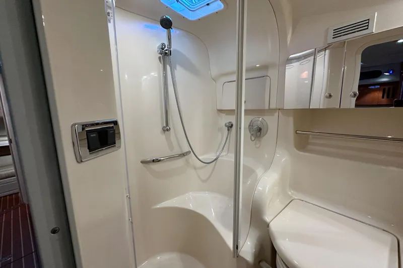 Slide: The Image of Luxurious bathroom in 2001 Sea Ray 410 Sundancer yacht, featuring modern shower and sleek design. - 39