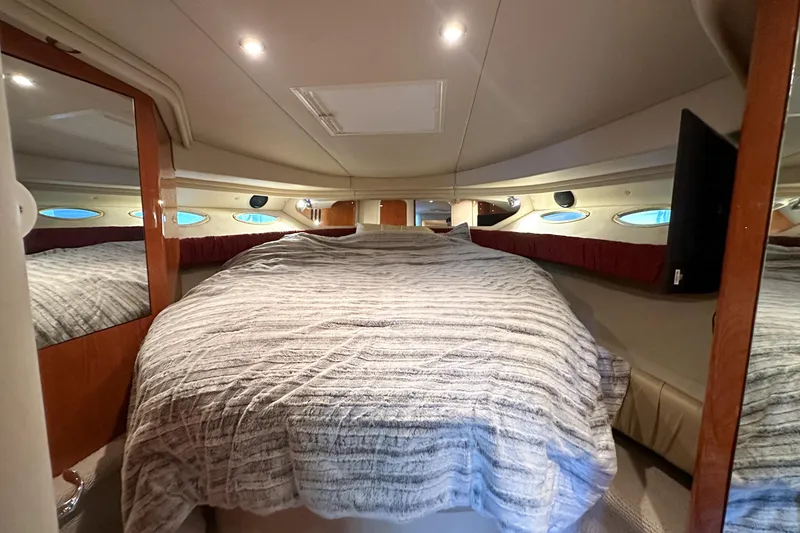 Slide: The Image of Luxurious cabin interior of 2001 Sea Ray 410 Sundancer yacht with cozy bedding. - 40