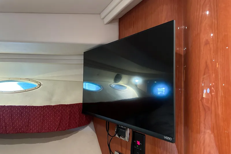 Slide: The Image of Flat-screen TV in 2001 Sea Ray 410 Sundancer cabin with porthole view. - 41