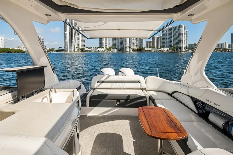 Slide: The Image of Luxurious 2019 Regal 33 OBX yacht interior with city skyline view. - 10