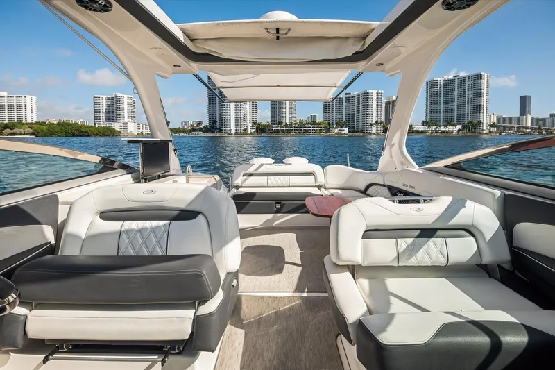 Slide: The Image of Luxurious 2019 Regal 33 OBX boat interior with waterfront cityscape view. - 12