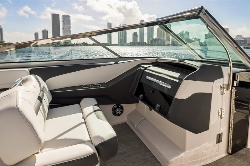 Slide: The Image of Interior of 2019 Regal 33 OBX boat with city skyline in background. - 15