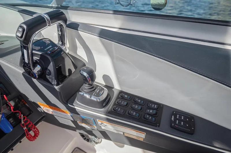 Slide: The Image of Control panel of a 2019 Regal 33 OBX boat with joystick and throttle. - 18