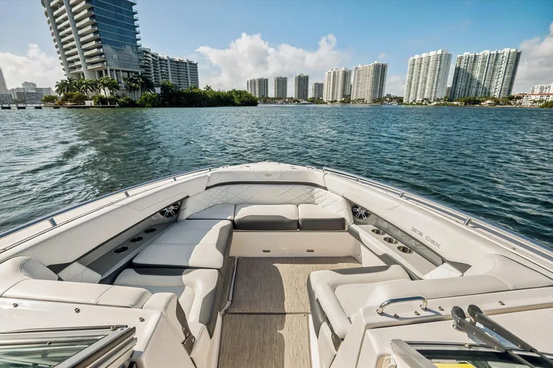 Slide: The Image of Luxurious 2019 Regal 33 OBX boat interior with waterfront cityscape view. - 21
