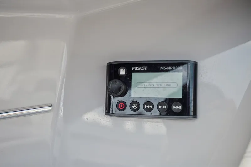 Slide: The Image of Fusion MS-NRX300 stereo system on 2019 Regal 33 OBX boat dashboard. - 30