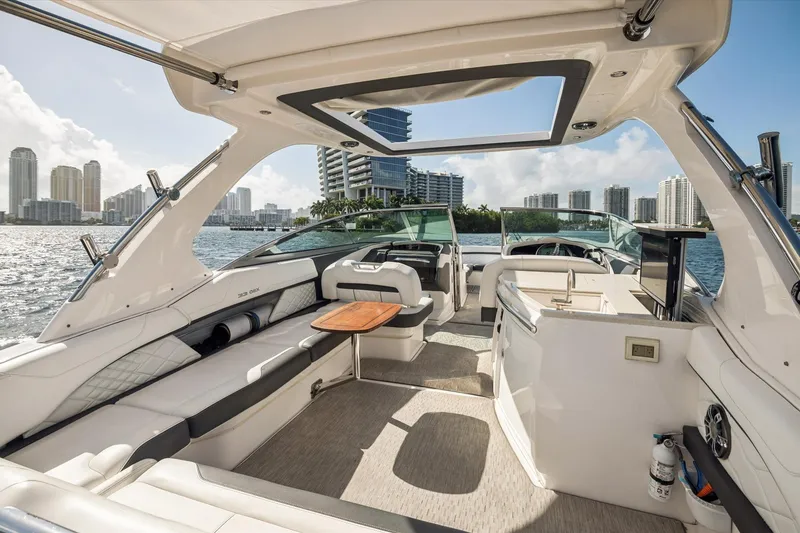 Slide: The Image of Luxurious 2019 Regal 33 OBX yacht interior with city skyline view. - 6