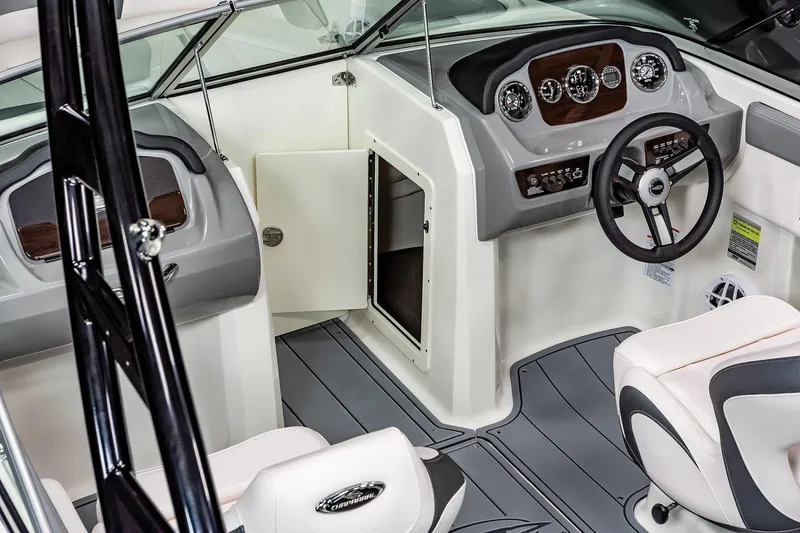 Slide: The Image of Manufacturer Provided Image: Interior of 2025 Chaparral 21 SSi boat, featuring sleek dashboard and comfortable seating. - 11