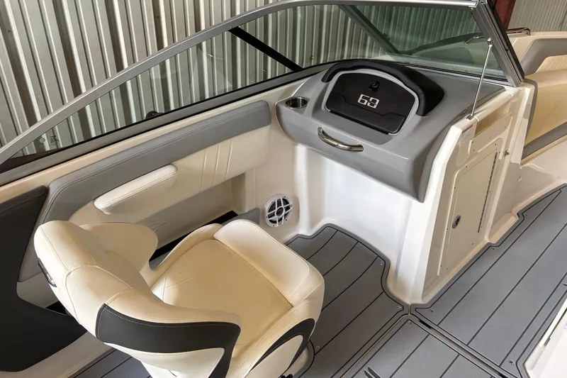 Slide: The Image of 2025 Chaparral 21 SSi boat interior with modern dashboard and comfortable seating. - 3
