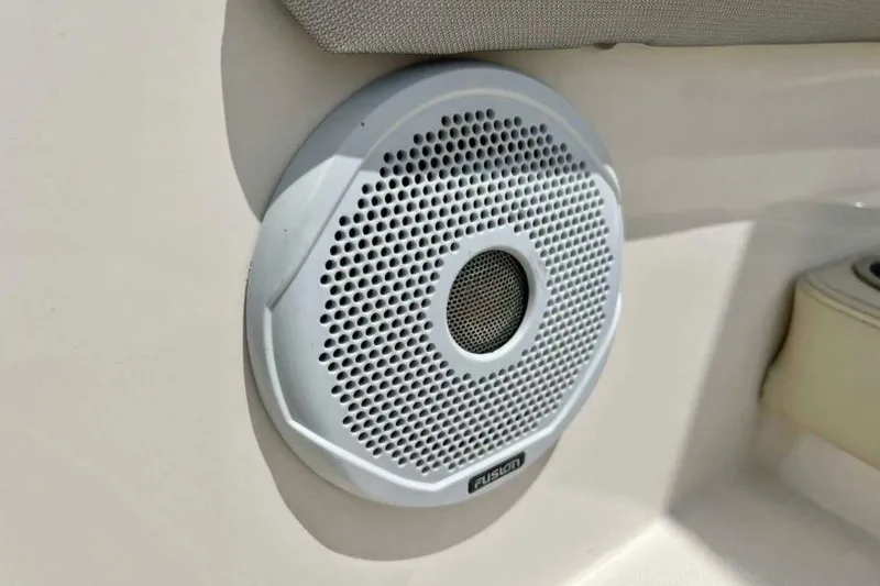 Slide: The Image of Speaker on 2019 Regal 26 XO boat interior, featuring Fusion audio system. - 15