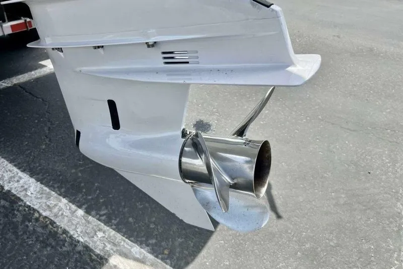 Slide: The Image of 2019 Regal 26 XO boat propeller and outdrive on pavement. - 17