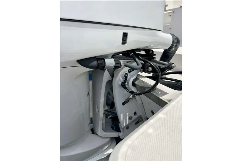 Slide: The Image of Close-up of 2019 Regal 26 XO boat engine components and wiring. - 18