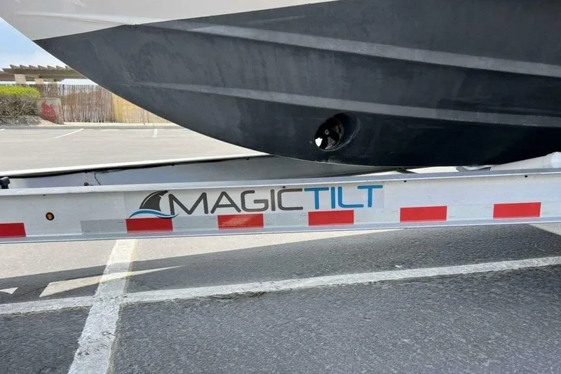Slide: The Image of Trailer with "Magic Tilt" logo carrying a 2019 Regal 26 XO boat. - 21