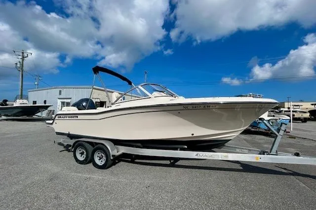 Slide: The Image of 2022 Grady-White Freedom 215 boat on trailer under blue sky. - 3