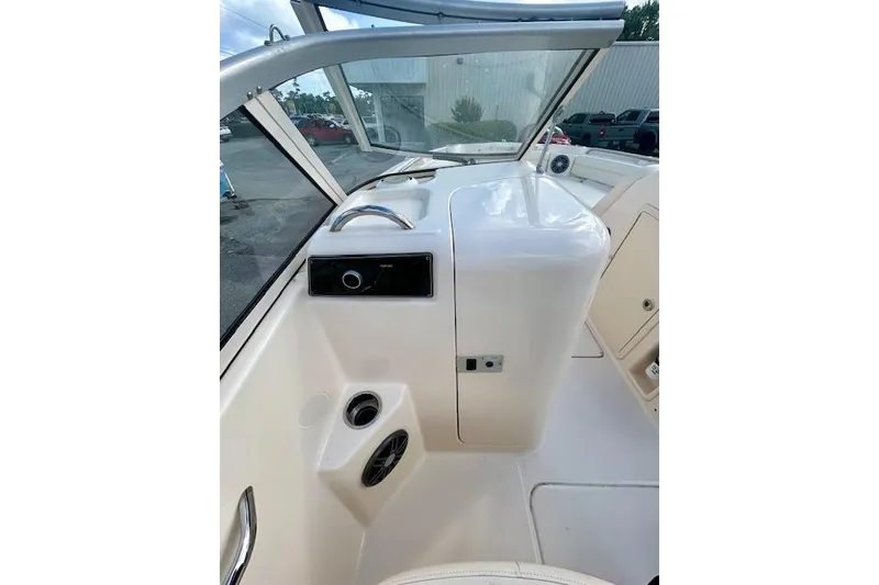 Slide: The Image of 2022 Grady-White Freedom 215 boat interior with dashboard and seating area. - 5