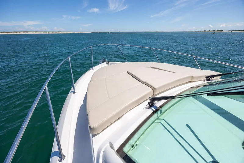 Slide: The Image of Boston Whaler 315 Conquest 2017 boat cruising on open water under clear skies. - 10