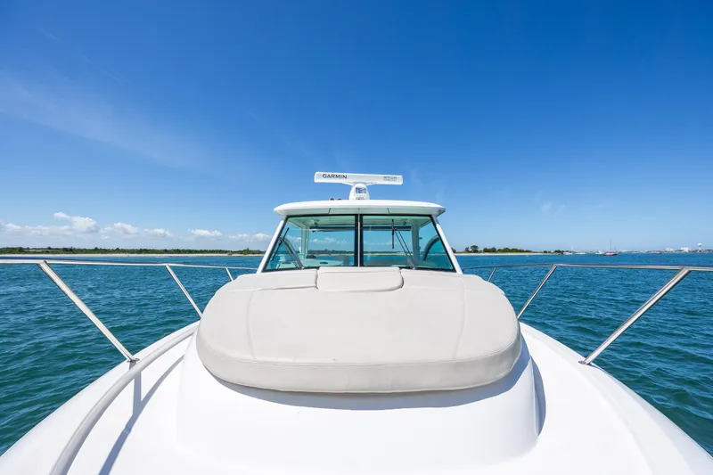 Slide: The Image of 2017 Boston Whaler 315 Conquest boat on open water under clear blue sky. - 12