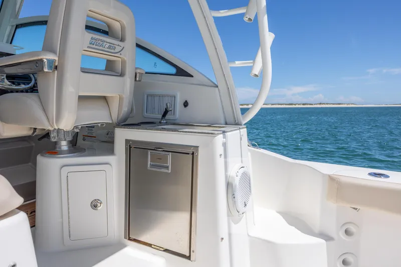 Slide: The Image of 2017 Boston Whaler 315 Conquest interior with seating and ocean view. - 20