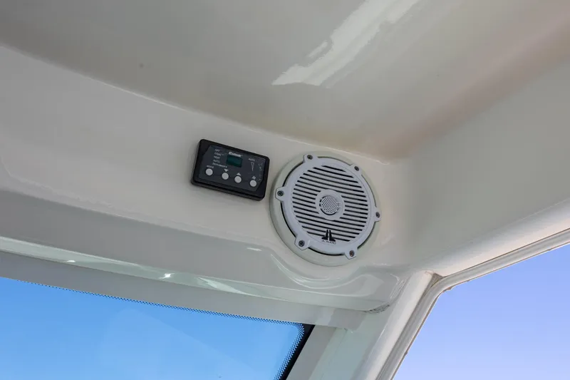 Slide: The Image of Speaker and control panel on 2017 Boston Whaler 315 Conquest boat interior. - 22