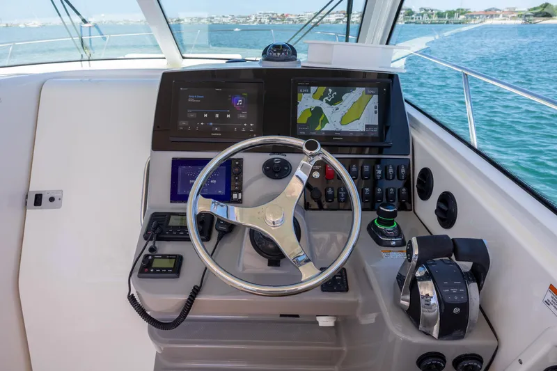 Slide: The Image of Helm of 2017 Boston Whaler 315 Conquest with navigation and control systems. - 24