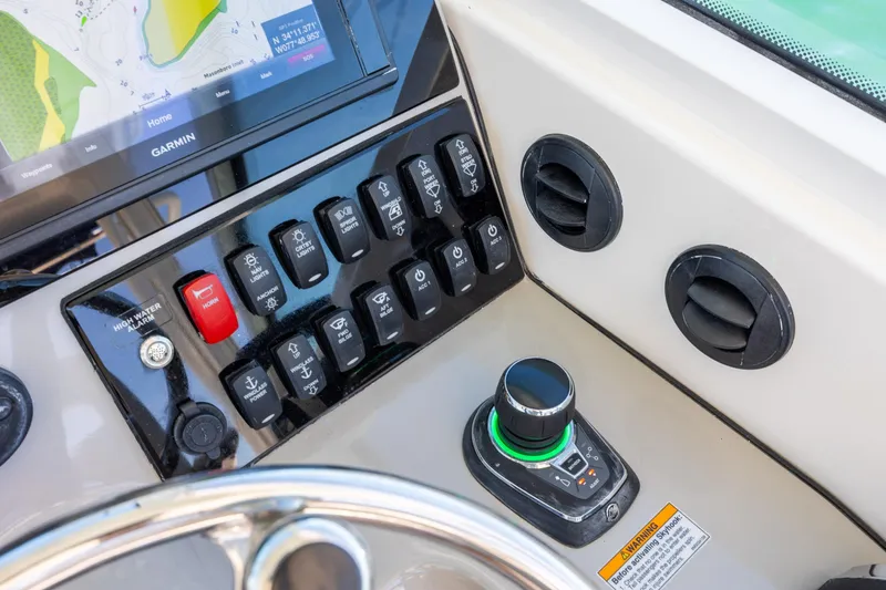 Slide: The Image of Control panel of 2017 Boston Whaler 315 Conquest boat with Garmin navigation system. - 26