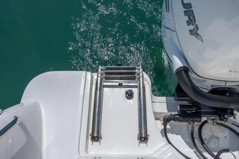 Slide: The Image of 2017 Boston Whaler 315 Conquest swim platform with ladder and Mercury engine. - 47