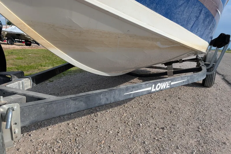 Slide: The Image of 2017 Lowe Fishing Machine 165SC Pro on trailer, side view. - 11
