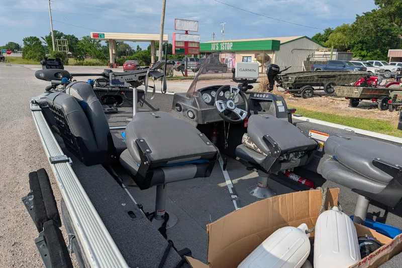 Slide: The Image of 2017 Lowe Fishing Machine 165SC Pro boat interior with seats and Garmin equipment. - 15