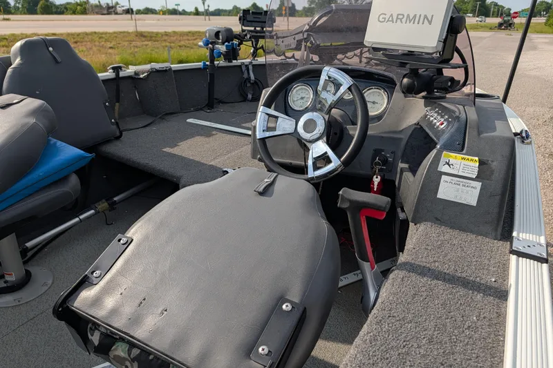 Slide: The Image of 2017 Lowe Fishing Machine 165SC Pro interior with Garmin navigation system and steering console. - 16