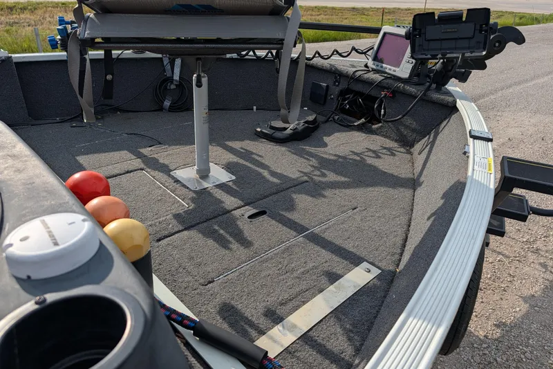 Slide: The Image of 2017 Lowe Fishing Machine 165SC Pro boat interior with fishing equipment and electronics. - 18