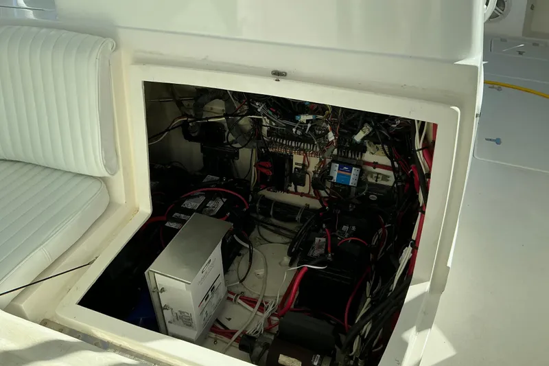 Slide: The Image of Electrical compartment of a 2005 Intrepid 348 Walkaround boat, showing wiring and components. - 12
