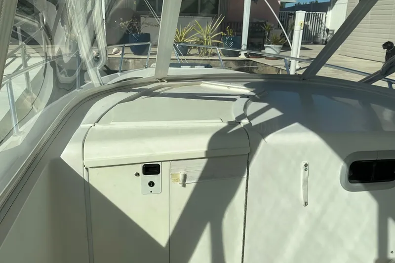 Slide: The Image of 2005 Intrepid 348 Walkaround boat interior with sunlight and shadows. - 13