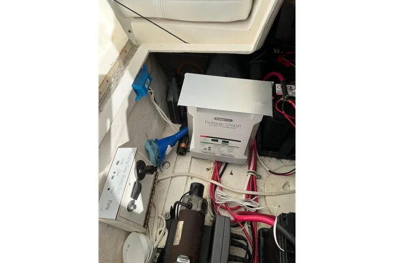 Slide: The Image of 2005 Intrepid 348 Walkaround boat interior showing electrical components and wiring. - 22