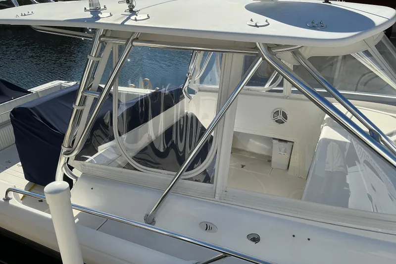 Slide: The Image of 2005 Intrepid 348 Walkaround boat with sleek design and stainless steel frame. - 3
