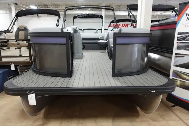 Slide: The Image of 2025 Flagship Pontoons D22 B XT pontoon boat in showroom. - 2