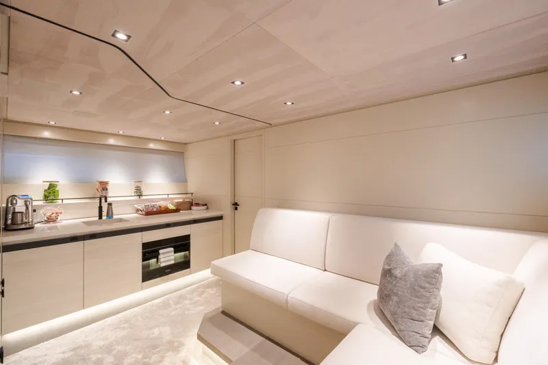 Slide: The Image of Luxurious interior of 2025 Wajer 77 yacht with modern kitchen and seating area. - 11