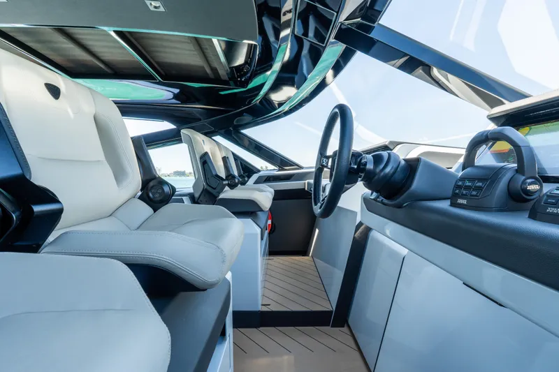 Slide: The Image of Luxurious interior of 2025 Wajer 77 yacht with modern steering and seating. - 16