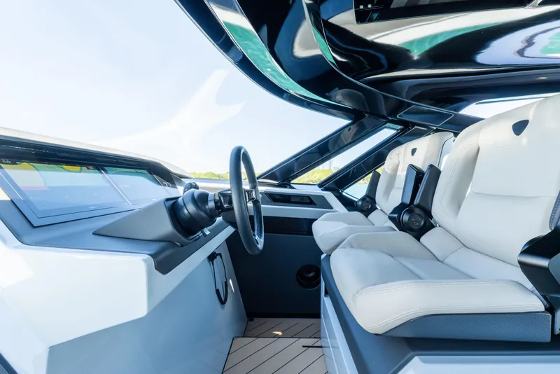 Slide: The Image of Interior of 2025 Wajer 77 yacht, featuring modern helm and luxurious seating. - 17