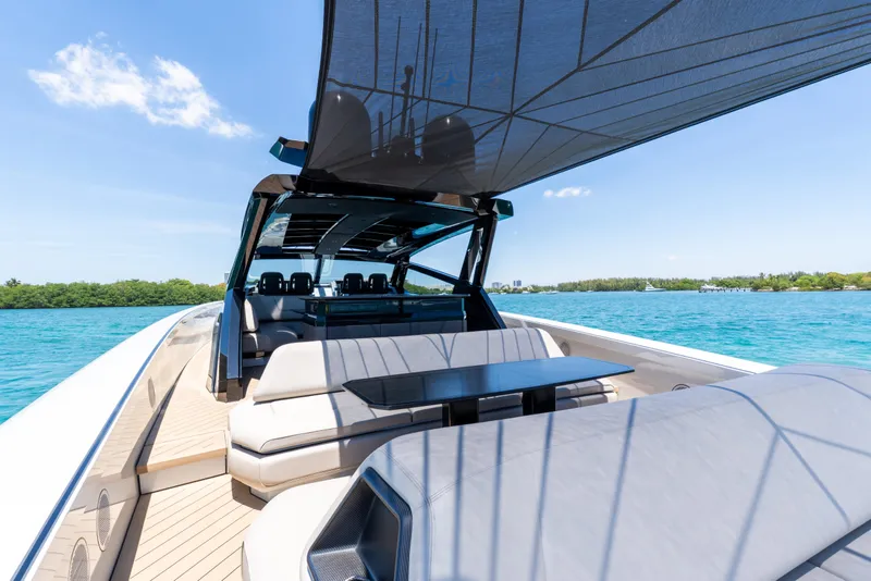 Slide: The Image of Luxury Wajer 77 yacht interior, 2025 model, featuring sleek seating and ocean view. - 19