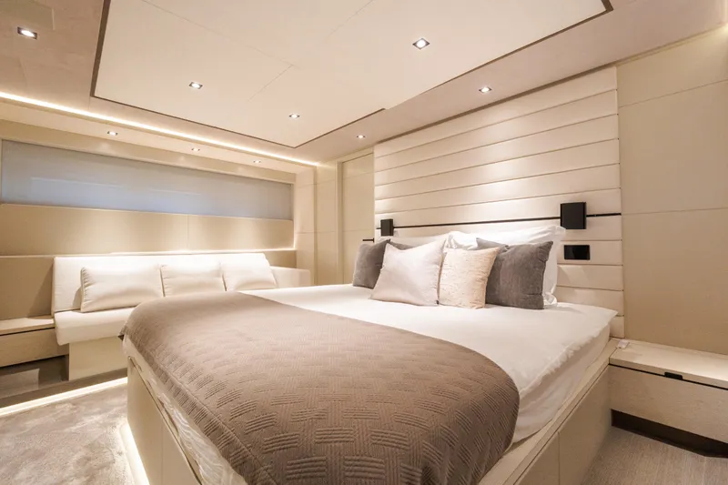 Slide: The Image of Luxurious interior cabin of 2025 Wajer 77 yacht with elegant bedding and modern lighting. - 2