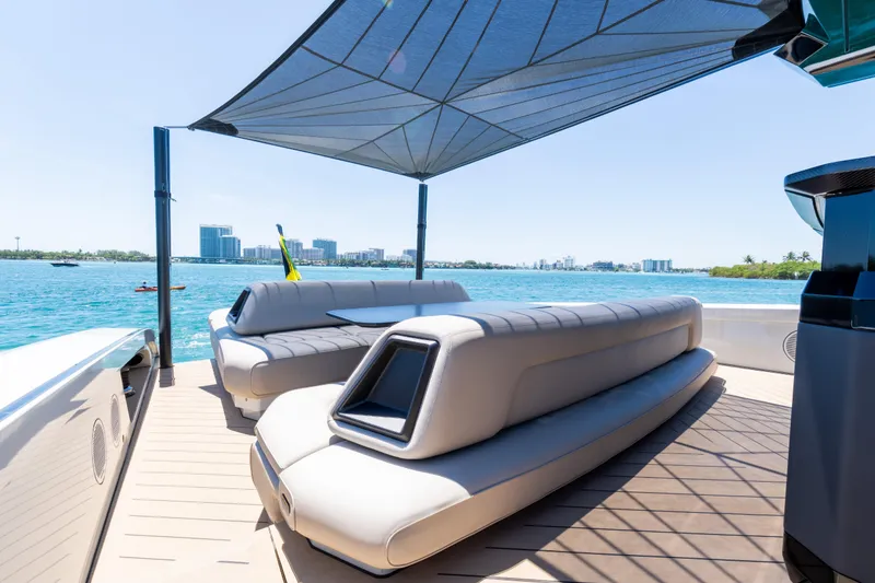 Slide: The Image of Luxurious 2025 Wajer 77 yacht deck with modern seating and sunshade on a sunny day. - 20