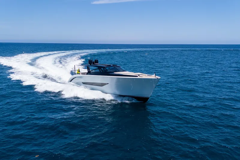 Slide: The Image of Luxury 2025 Wajer 77 yacht cruising on open sea under clear blue sky. - 26