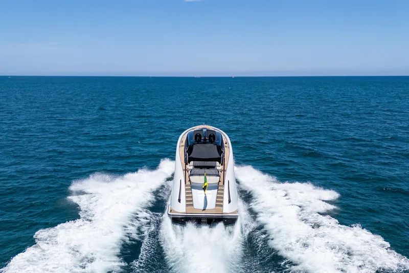 Slide: The Image of Luxury Wajer 77 yacht cruising on open sea, 2025 model, rear view. - 27