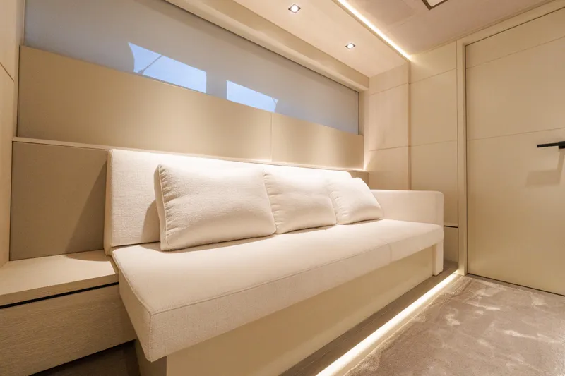 Slide: The Image of Luxurious interior of 2025 Wajer 77 yacht with elegant beige seating and ambient lighting. - 5