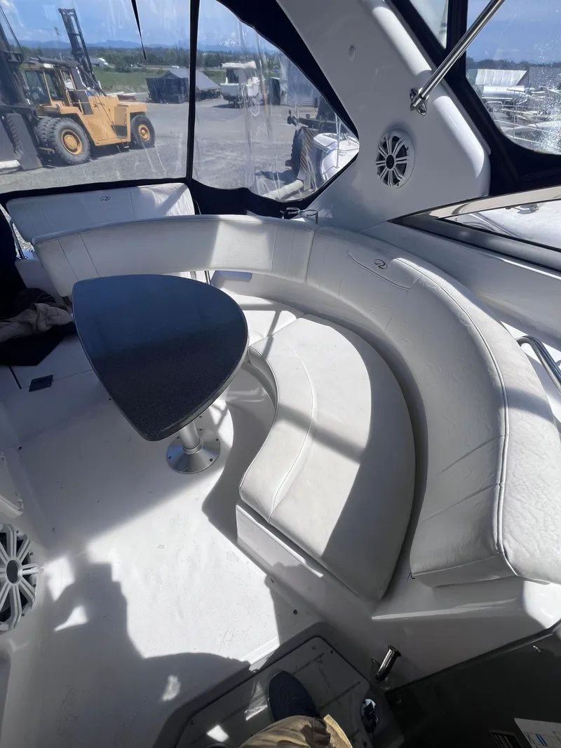 Slide: The Image of Interior of a 2007 Regal 3360 Window Express yacht with seating area. - 17