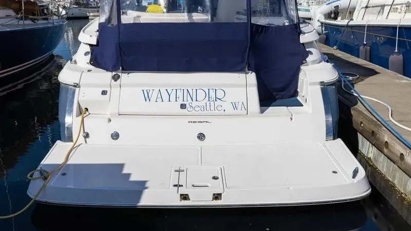 Slide: The Image of 2007 Regal 3360 Window Express boat docked in Seattle harbor. - 2