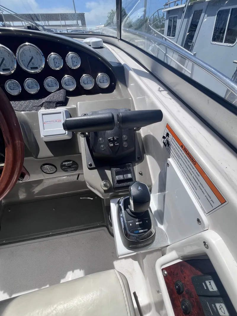 Slide: The Image of Control console of a 2007 Regal 3360 Window Express boat. - 21
