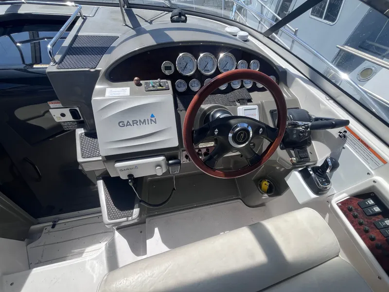 Slide: The Image of Cockpit of a 2007 Regal 3360 Window Express boat with Garmin navigation. - 23